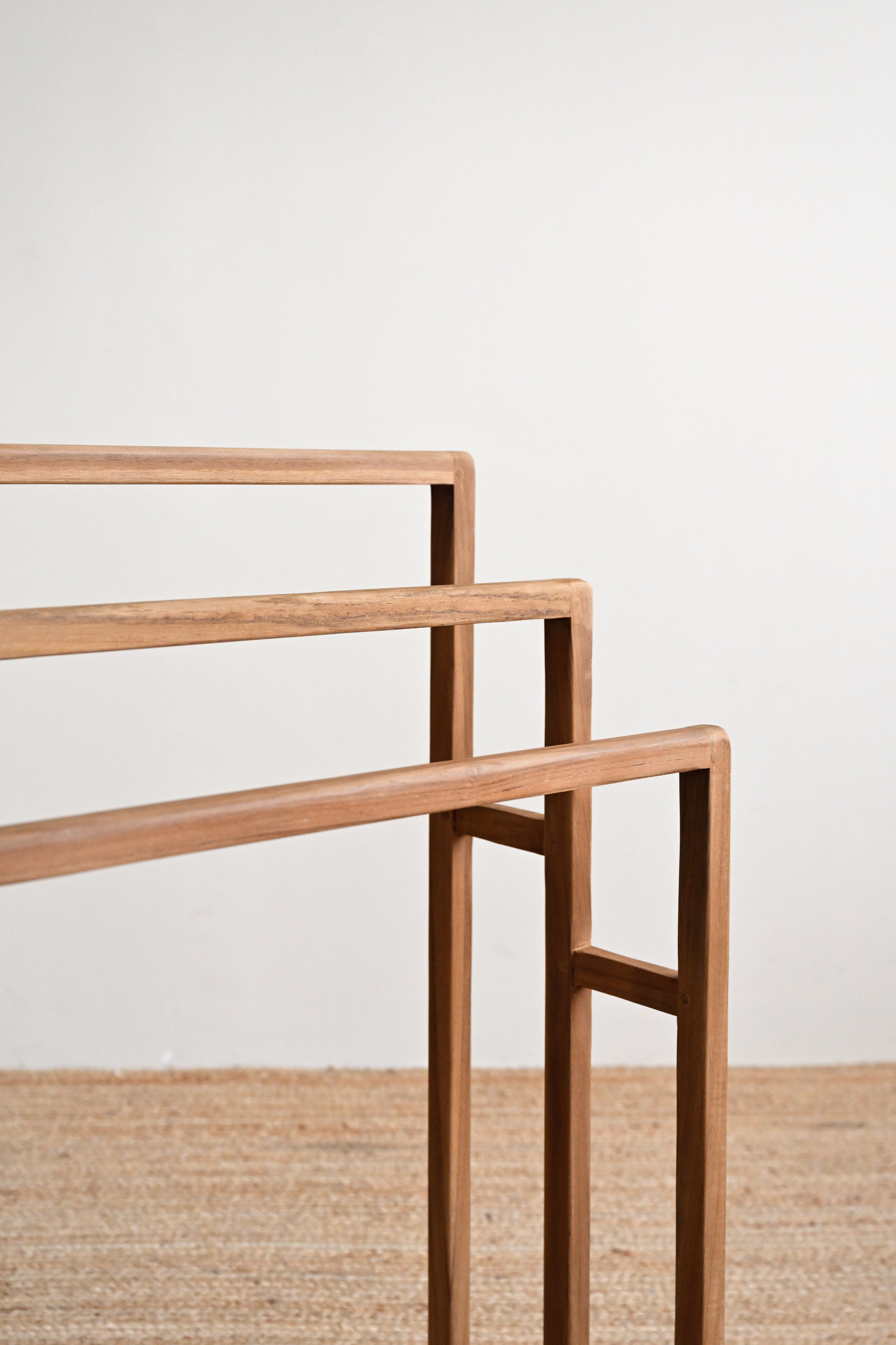 Wooden shelf with a minimalist design on a plain background
