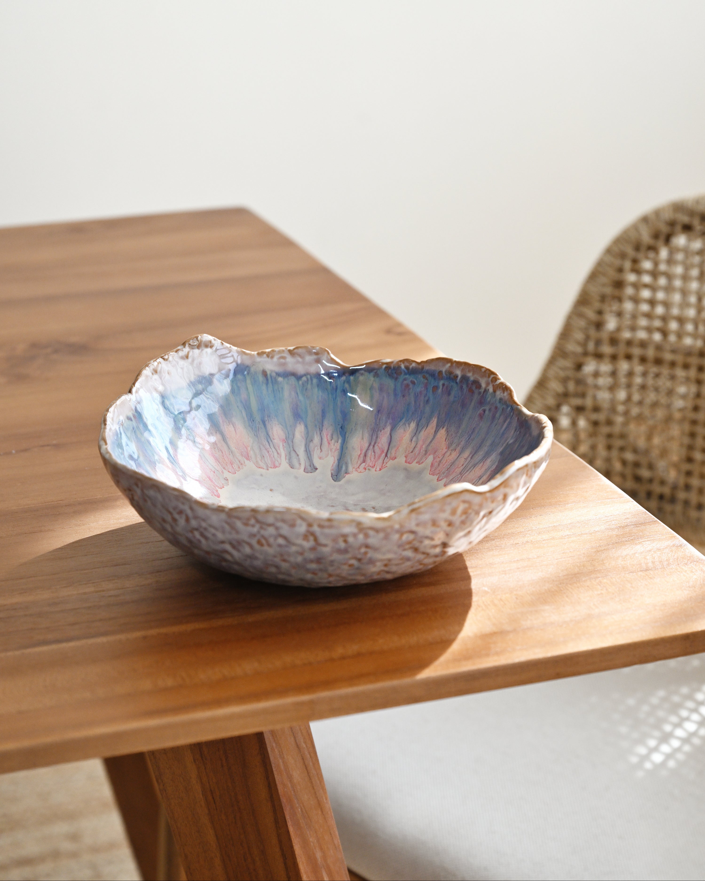 Ceramic bowl with a textured surface on a wooden table