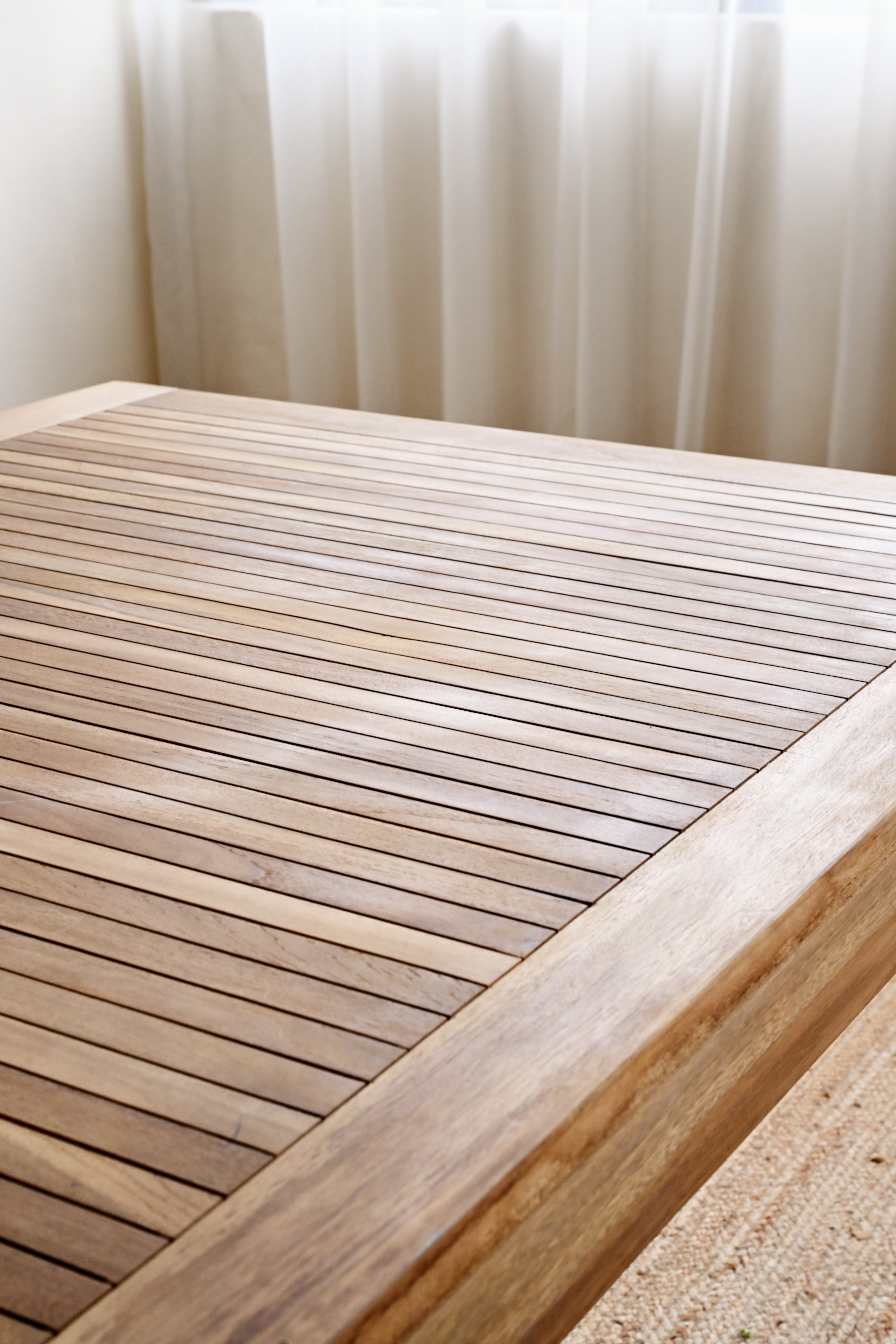 Wooden deck with a textured surface and a blurred background