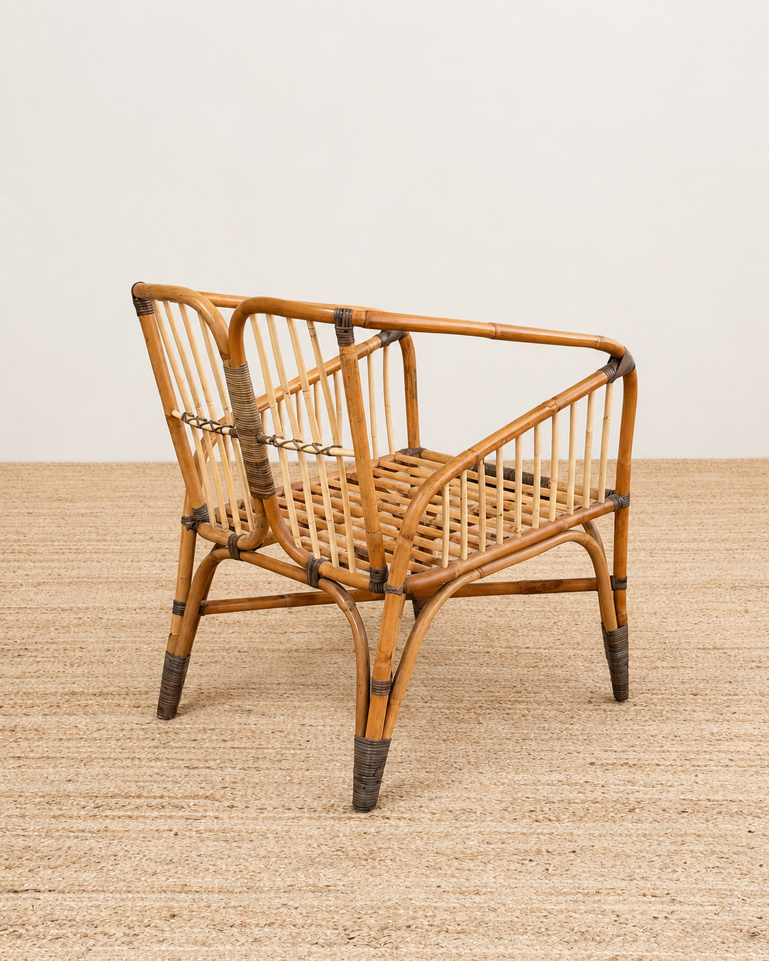 Wicker chair on a textured surface with a neutral background