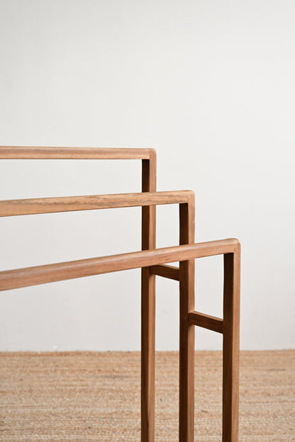 Wooden shelf with a minimalist design on a plain background