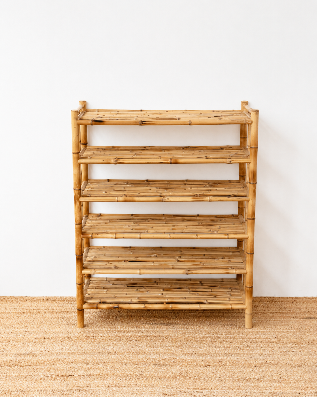 Wooden shelf with multiple shelves on a plain background