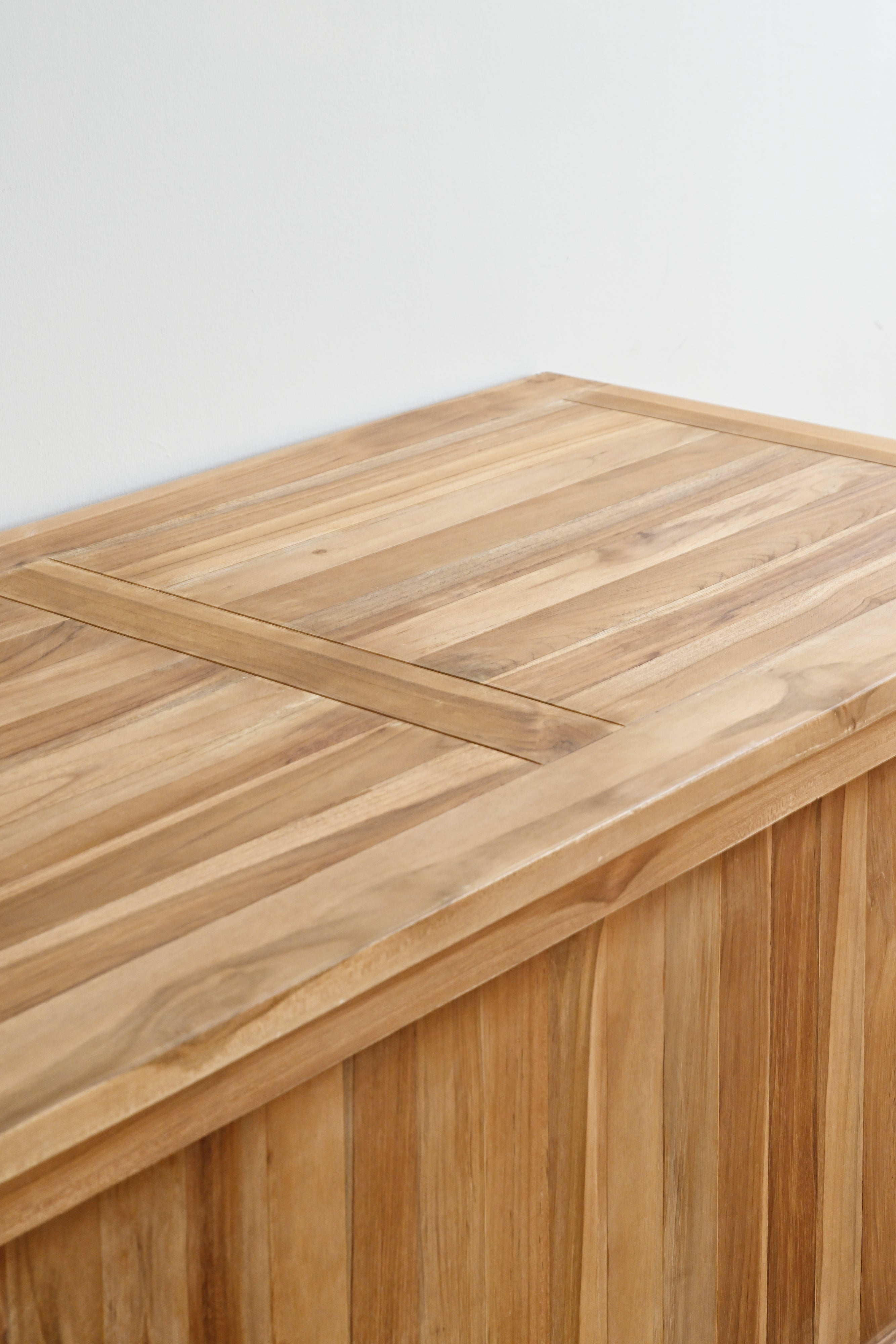 Wooden table with a light brown finish on a white background