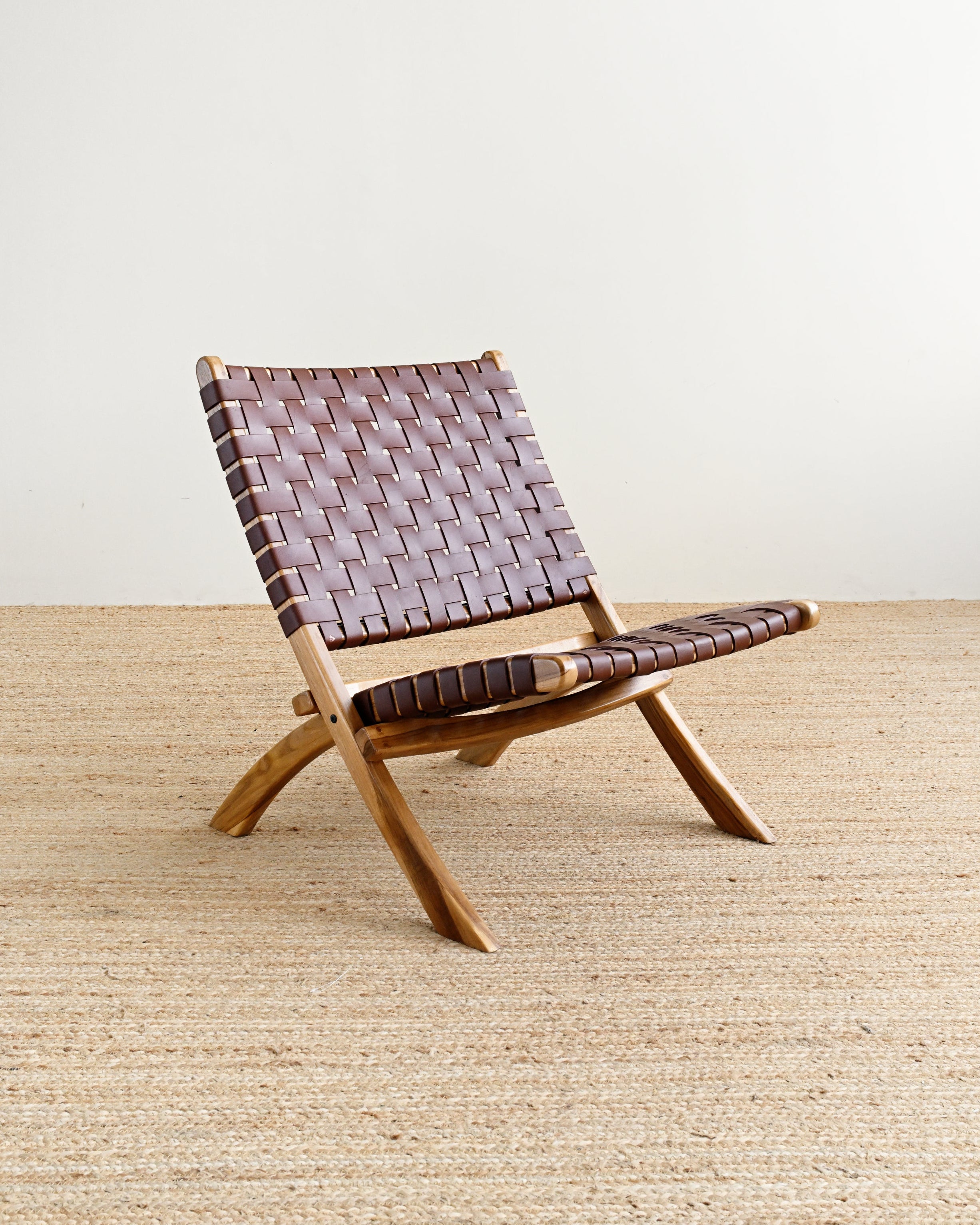 Wooden chair with woven backrest on a beige carpet