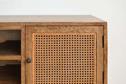 Wooden cabinet with wicker door on a white background