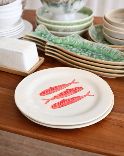 Dishes with fish design on a wooden table