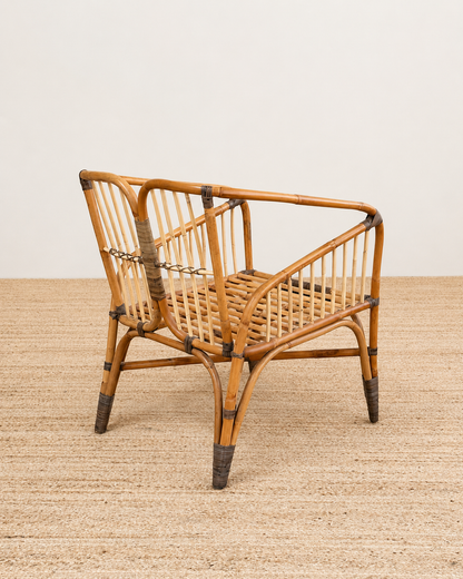 Wicker chair on a textured surface with a neutral background