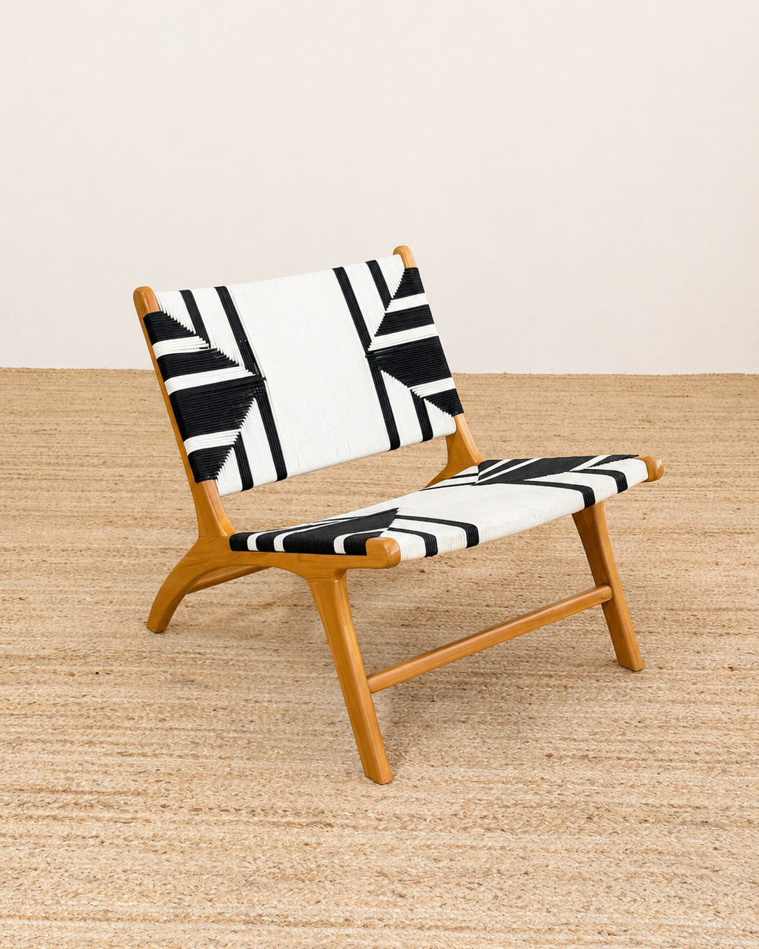 Chair with black and white geometric pattern on a wooden floor