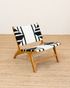 Chair with black and white geometric pattern on a wooden floor