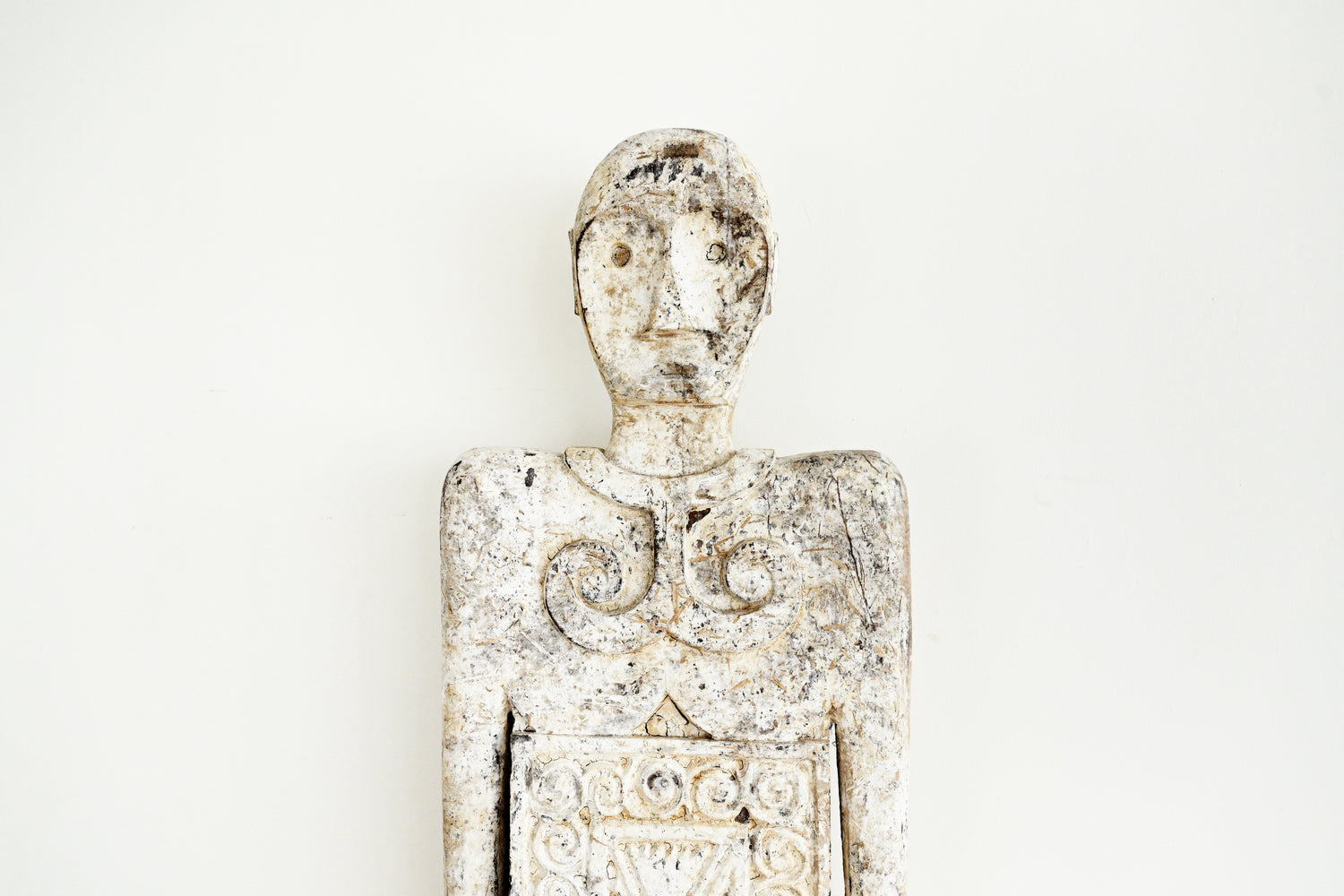 Decorative figurine with intricate details on a white background