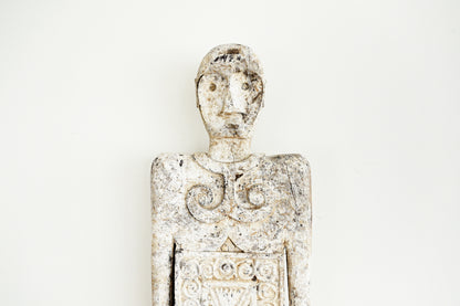 Decorative figurine with intricate details on a white background