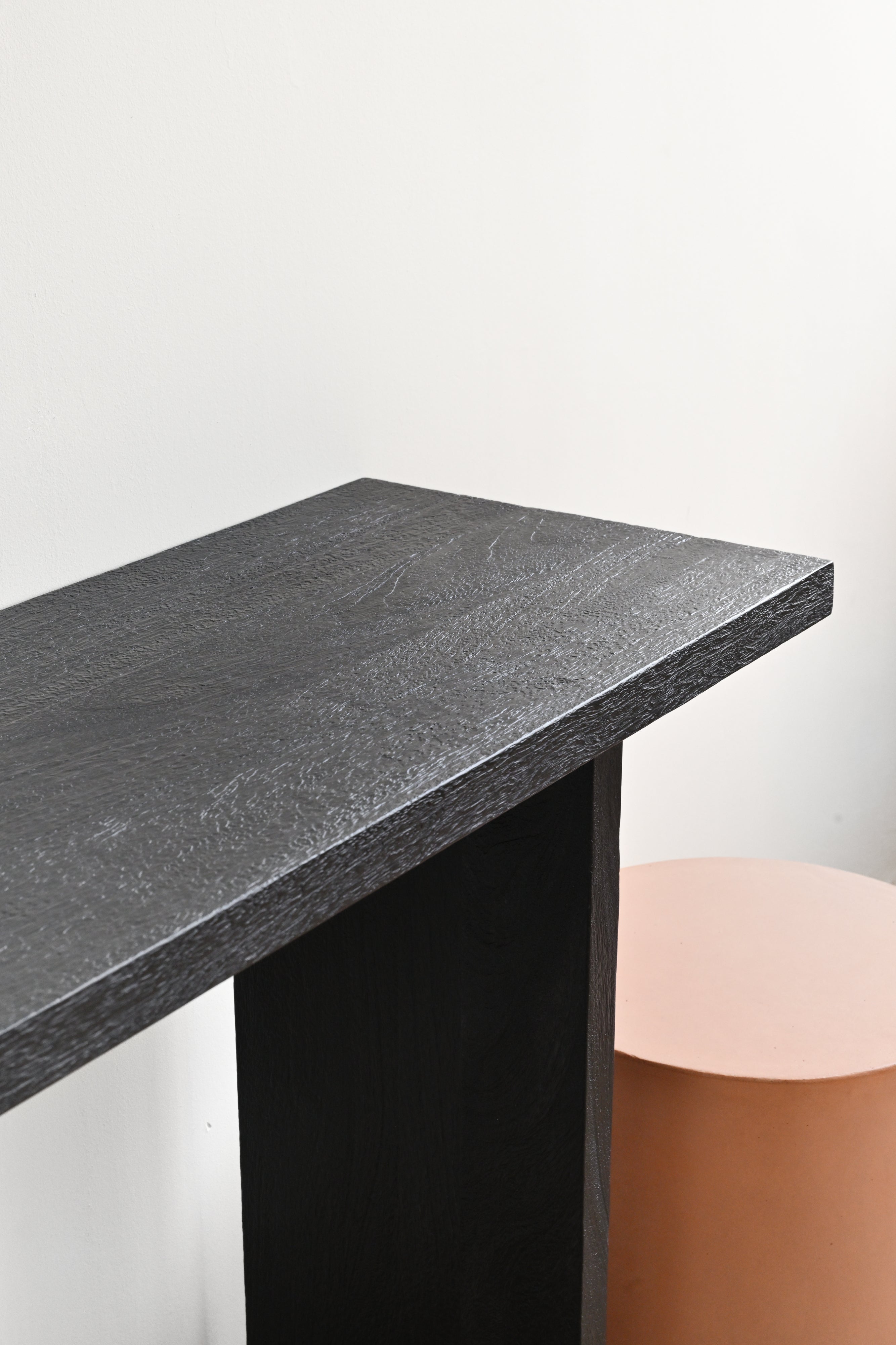Dark gray marble countertop with a black base on a white background