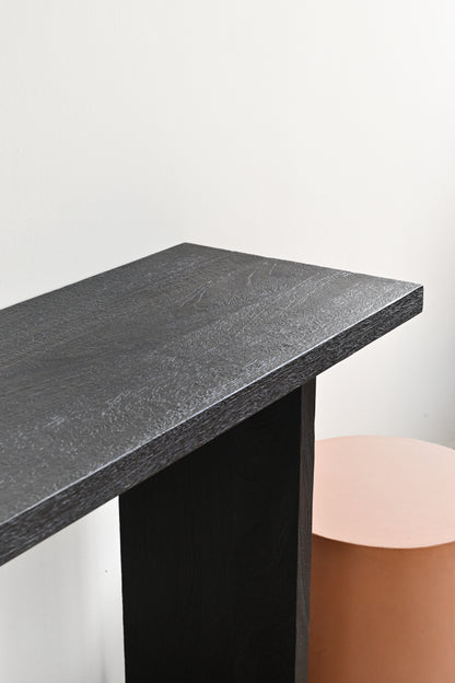 Dark gray marble countertop with a black base on a white background