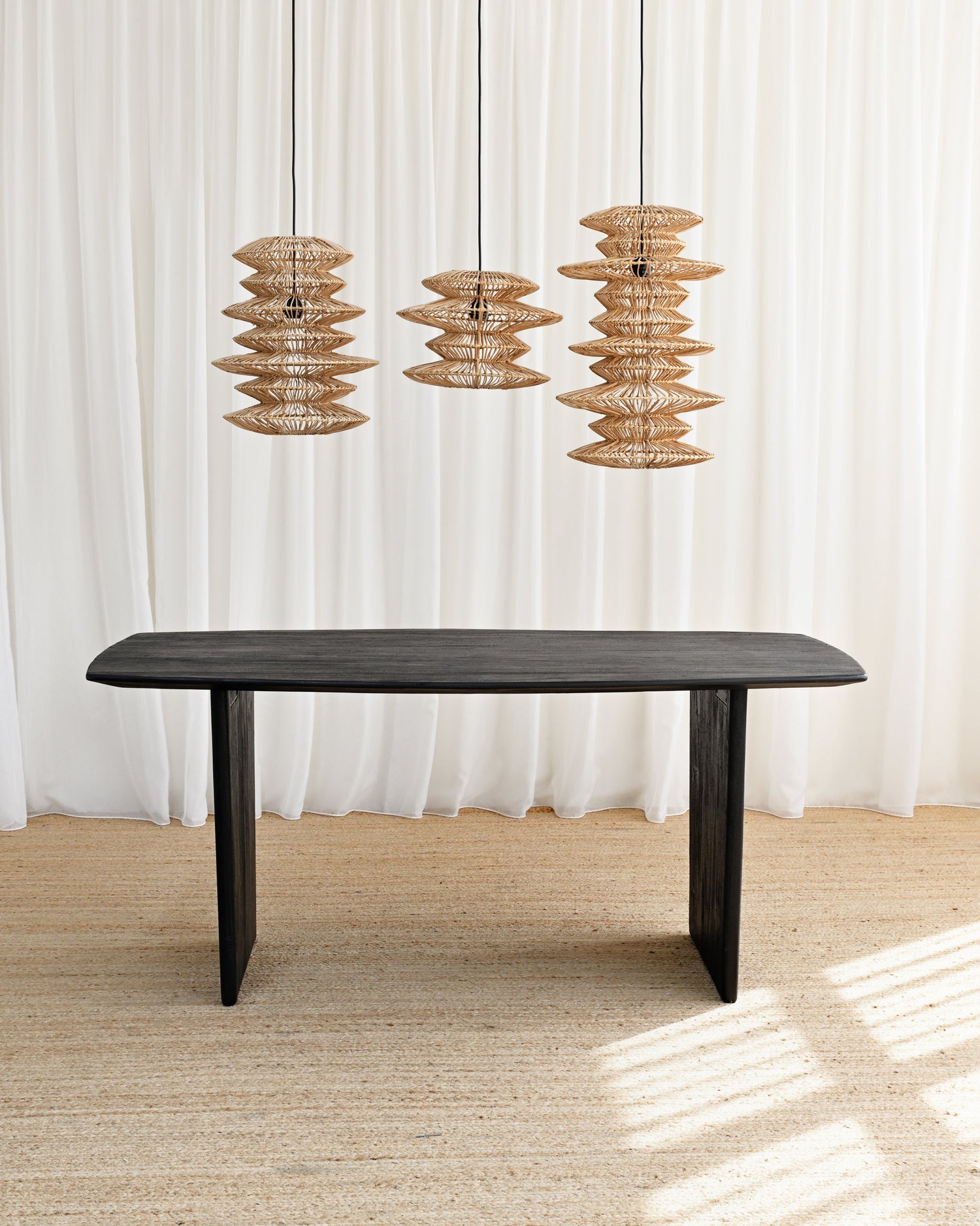 Solid teak black dining table with pendant lights 