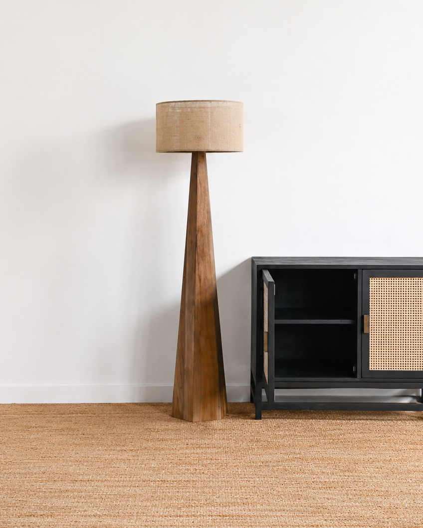Room with a textured beige carpet, wooden floor, and minimal furniture.