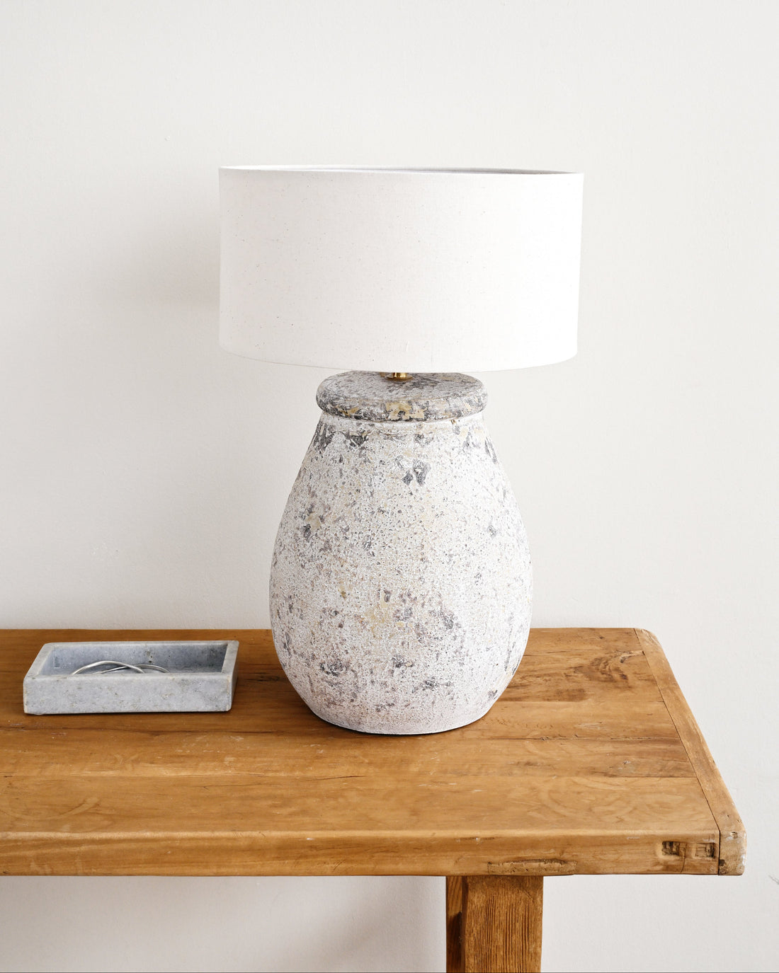 Decorative vase on a wooden table with a white background