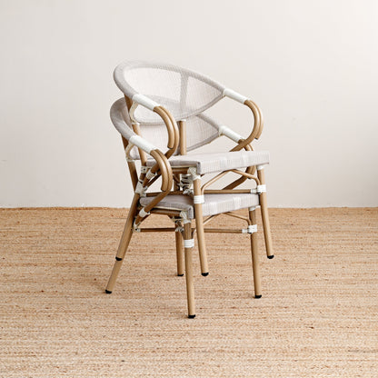 Chair with white cushion on a beige floor and light gray wall