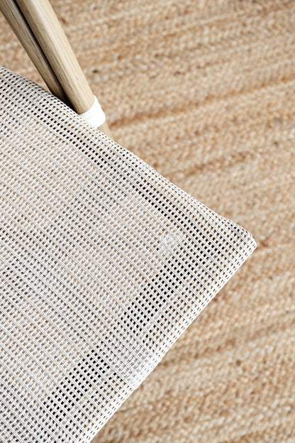 Close-up of a metal sifter on a wooden surface