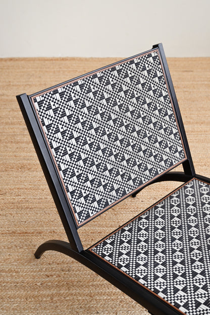 Chair with black and white geometric pattern on a wooden floor