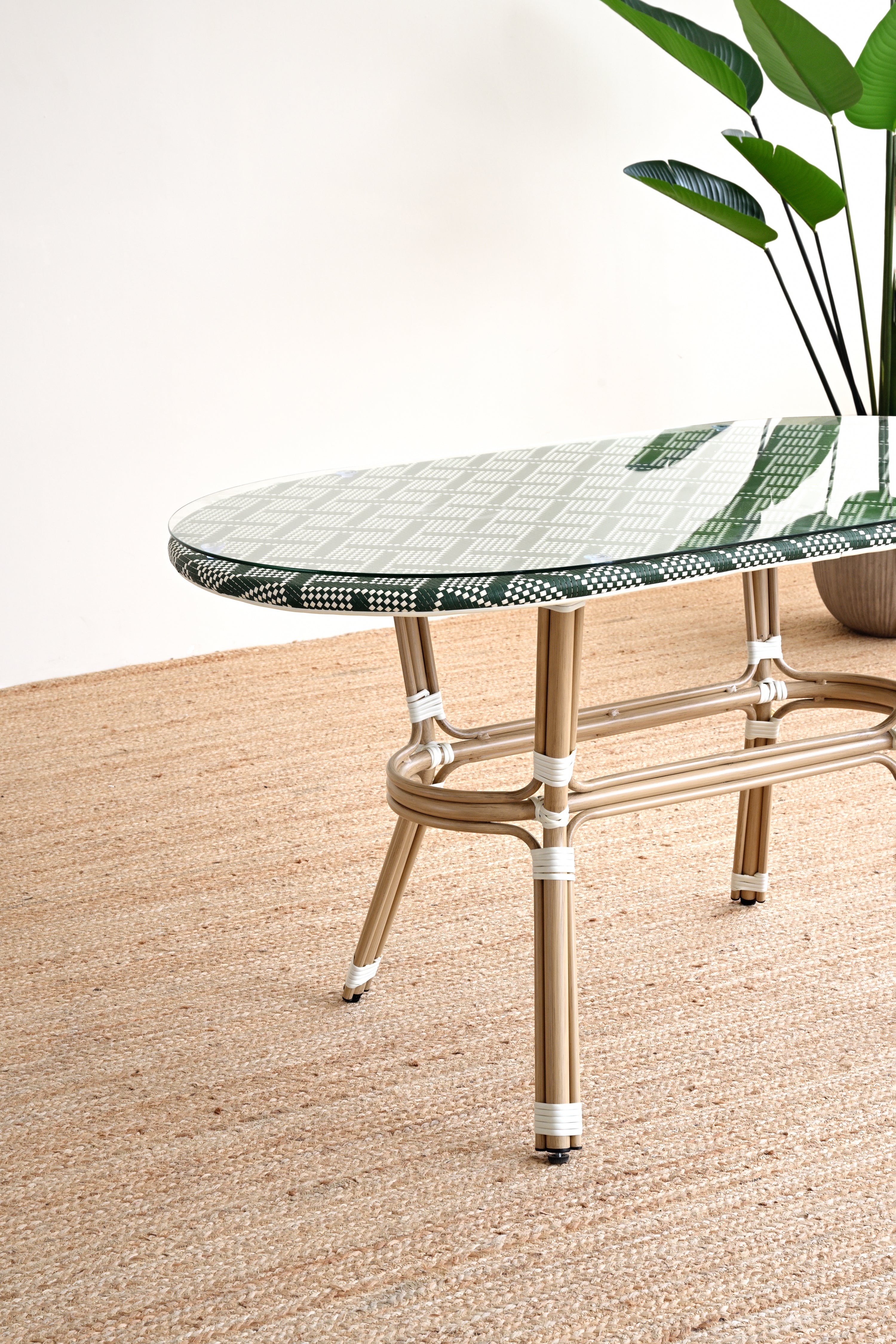 Glass table with metal frame on a textured surface