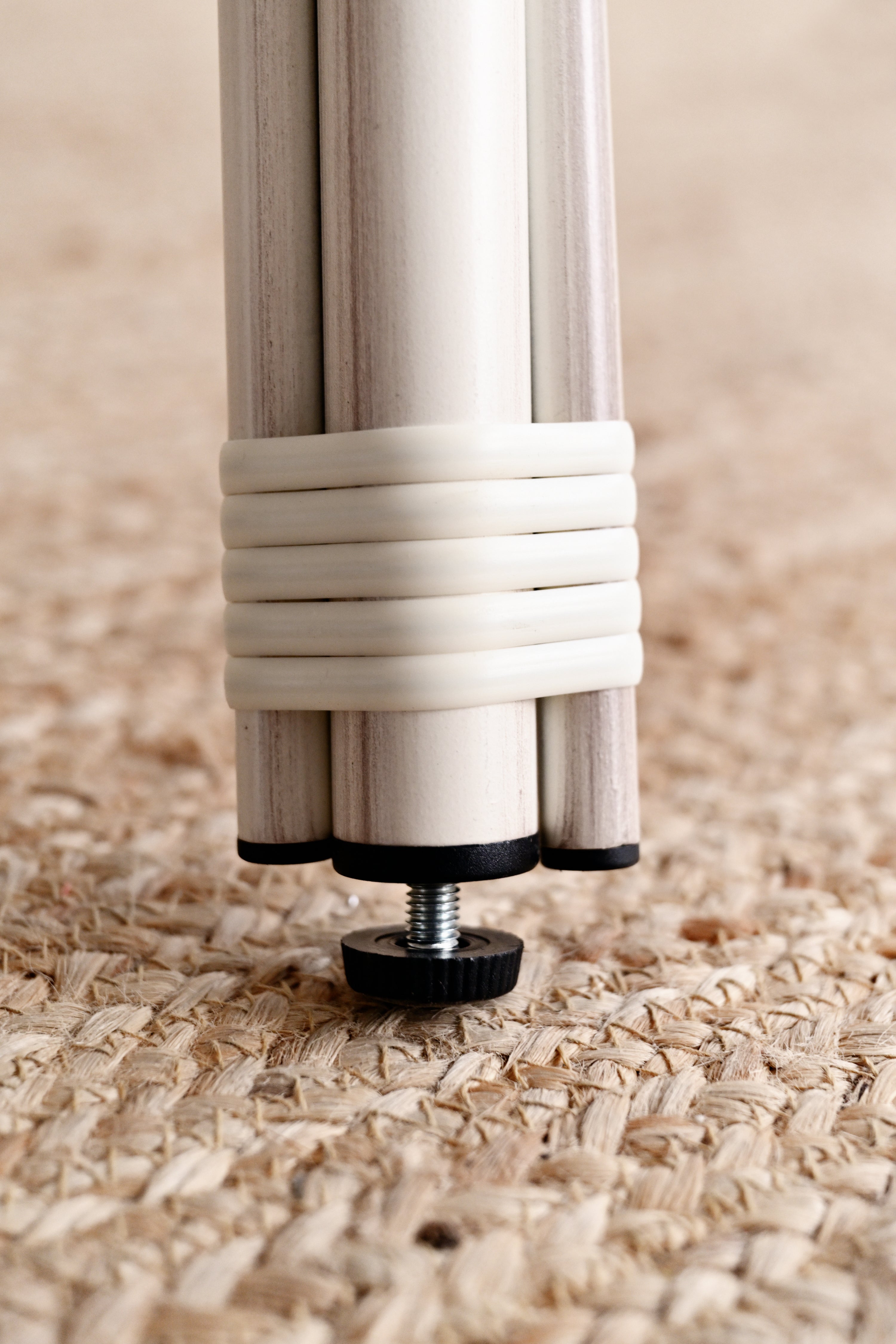 Close-up of a cylindrical object with a textured base on a woven surface