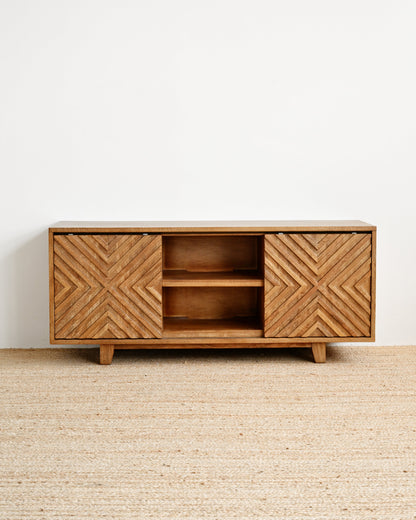 Wooden cabinet with geometric pattern on a white wall background