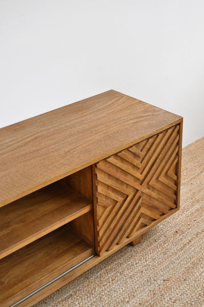 Wooden cabinet with geometric design on a neutral background