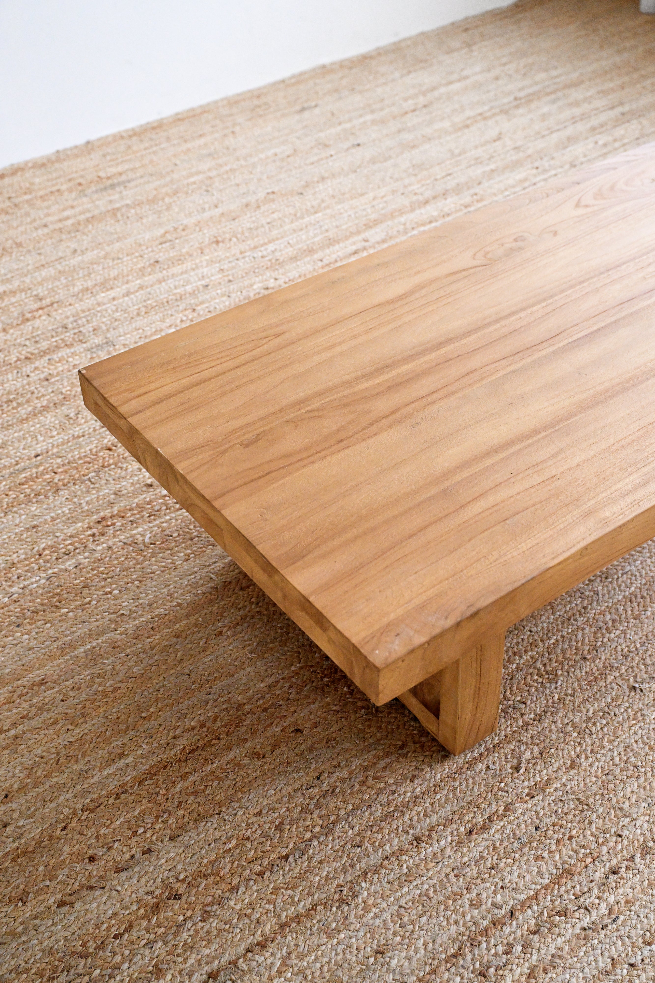 Wooden bench on a textured carpet
