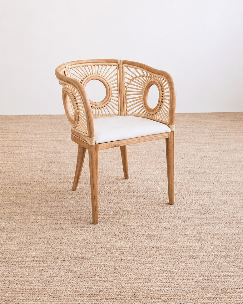 Wooden chair with a white cushion on a beige carpet