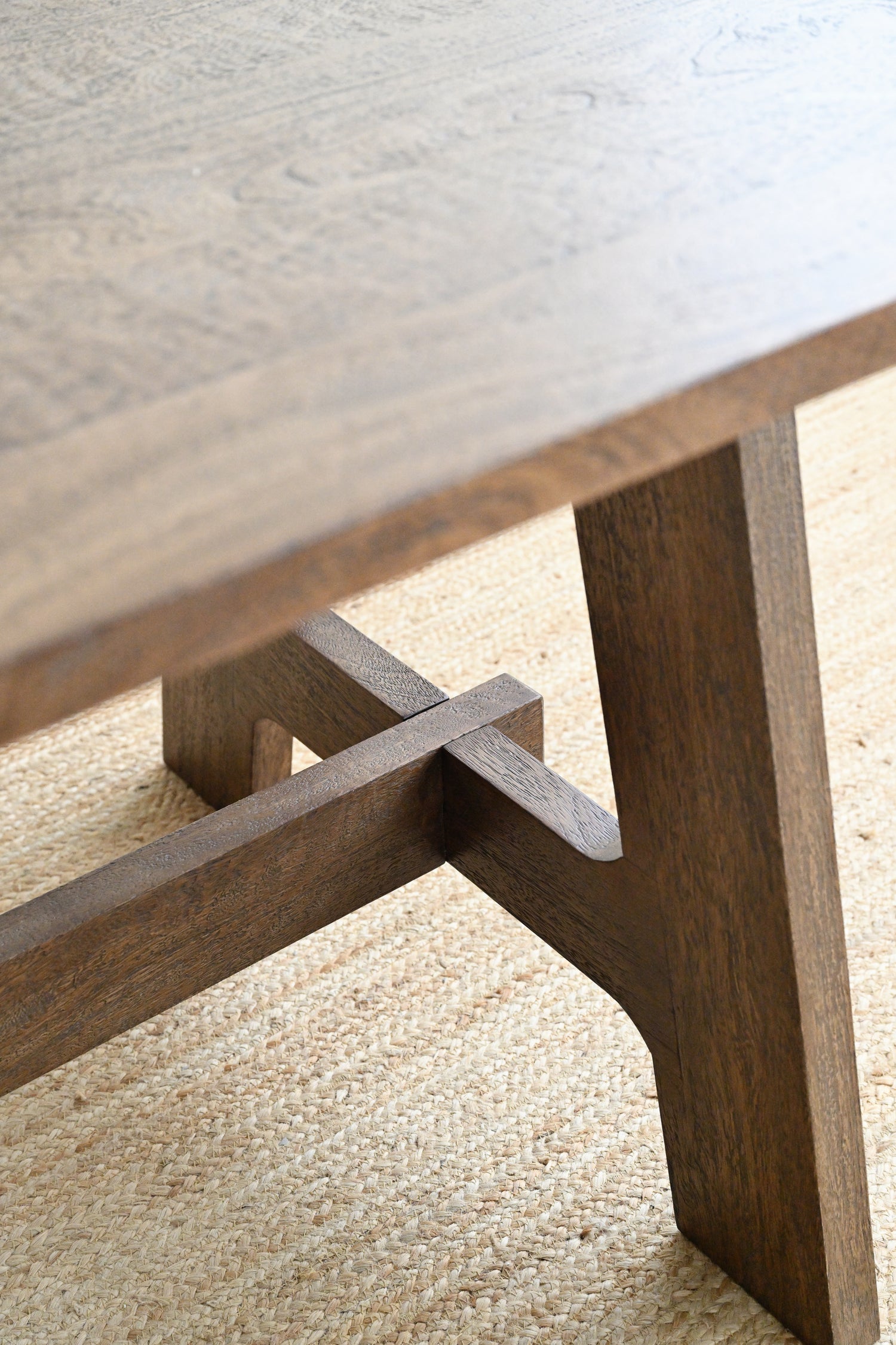 Close-up of a wooden table leg with a textured surface