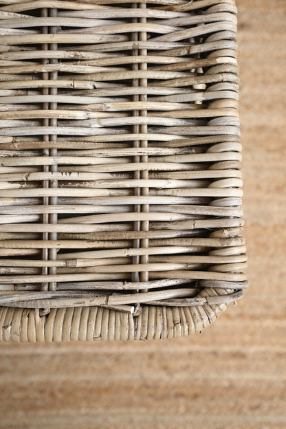 Close-up of a wicker basket corner on a wooden surface