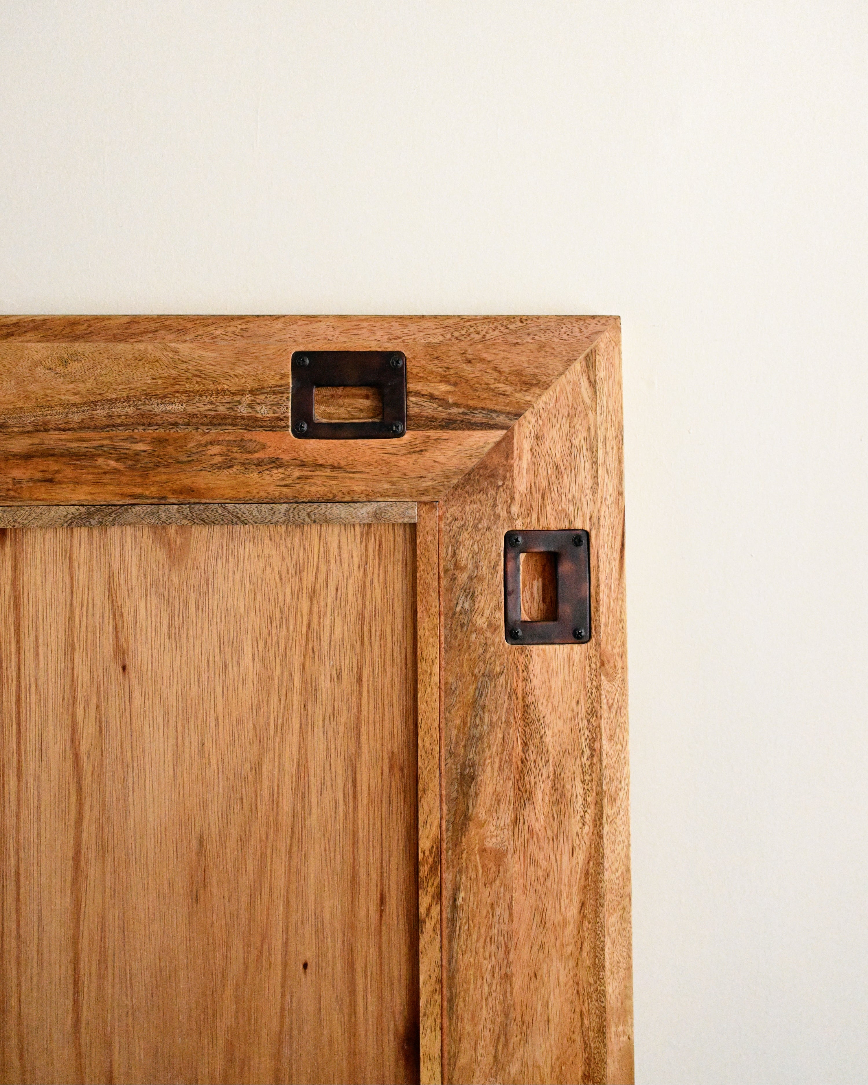 Wooden mirror with handles to hang it 