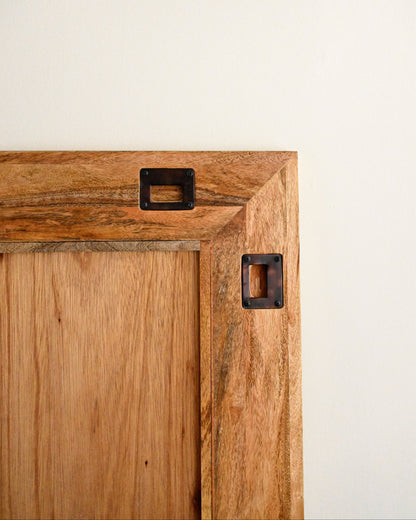 Wooden mirror with handles to hang it 
