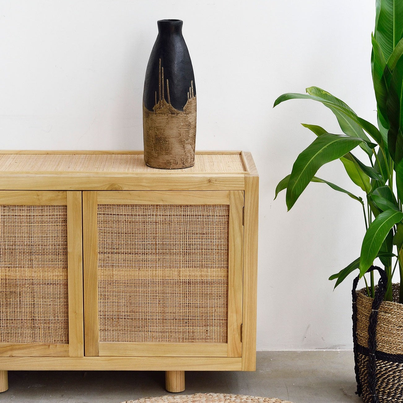 Black and Natural Vase on cabinet